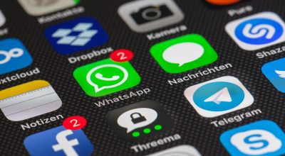 h漫网站隐私保护指南配图，盾牌图标与手机屏幕，蓝紫色调